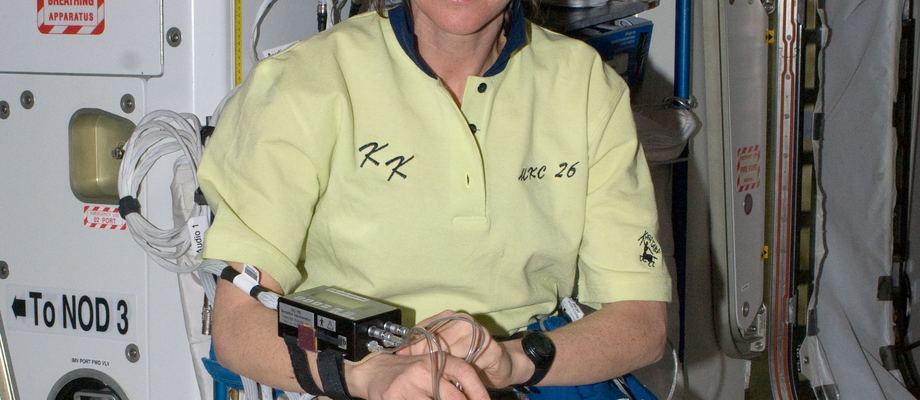 Cady Coleman wearing a Holter monitor on the space station, 2011